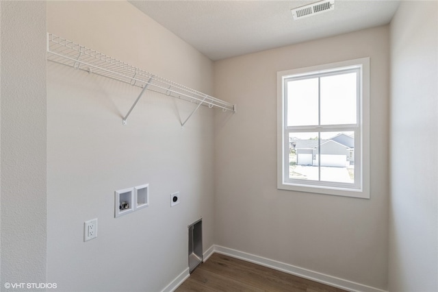 clothes washing area featuring hookup for a washing machine, dark wood-type flooring, and hookup for an electric dryer