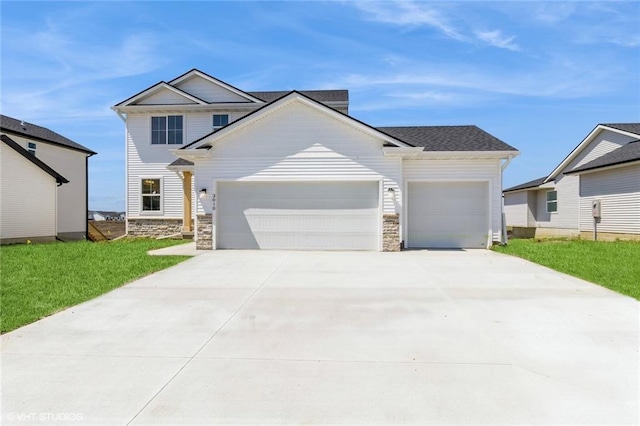 view of front facade with a front lawn and a garage