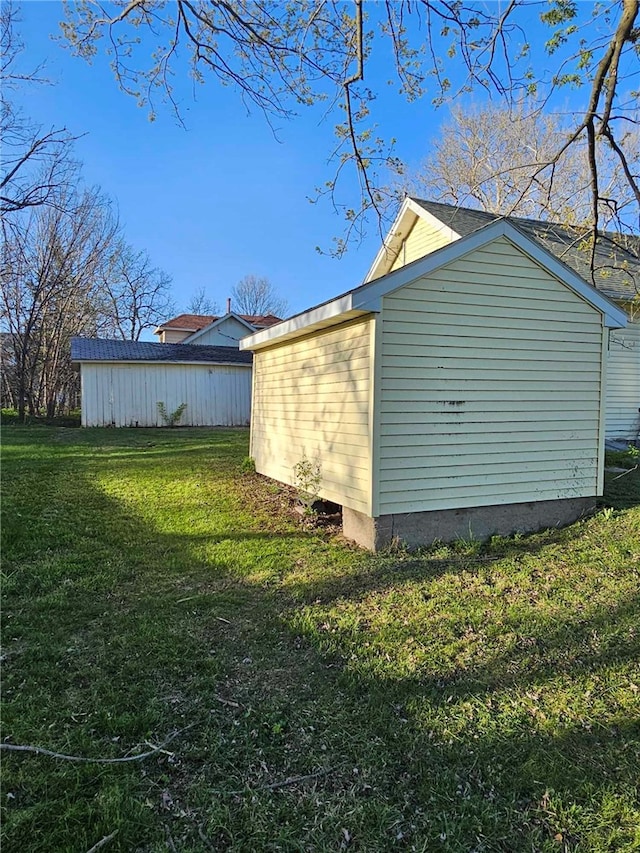 view of side of home featuring a yard