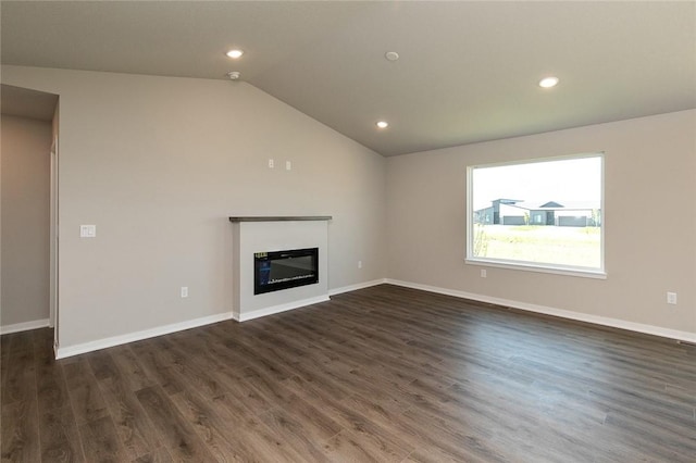 unfurnished living room with dark hardwood / wood-style flooring and vaulted ceiling