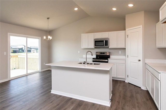 kitchen with white cabinetry, a kitchen island with sink, decorative light fixtures, and appliances with stainless steel finishes