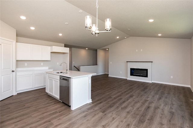 kitchen featuring a kitchen island with sink, dishwasher, white cabinets, and pendant lighting