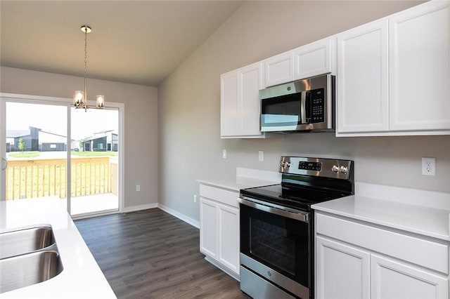 kitchen with white cabinetry, an inviting chandelier, pendant lighting, and appliances with stainless steel finishes