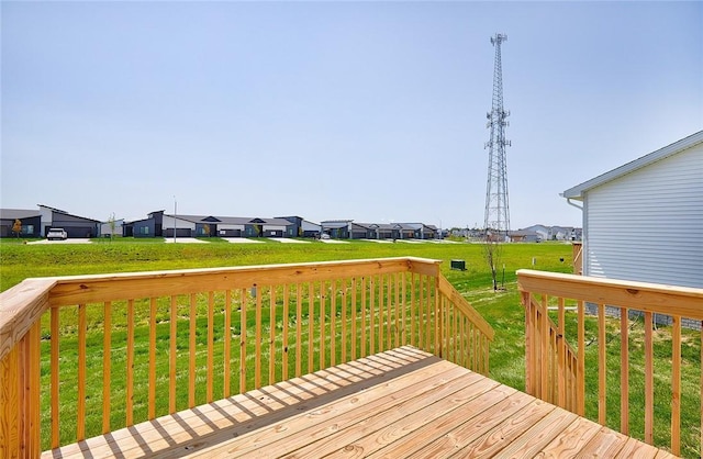 wooden terrace with a lawn