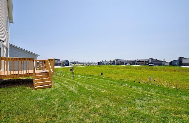 view of yard featuring a wooden deck