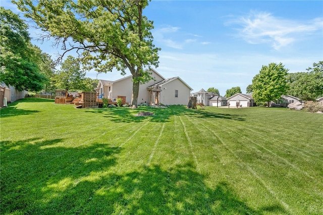 view of yard featuring a wooden deck