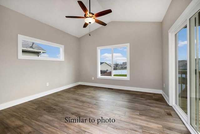 unfurnished room with ceiling fan, lofted ceiling, and dark hardwood / wood-style flooring