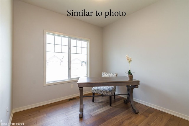 home office with hardwood / wood-style floors