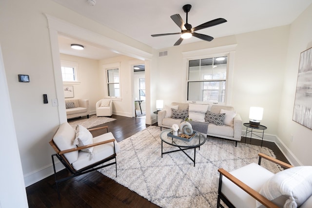 living room with hardwood / wood-style flooring and ceiling fan