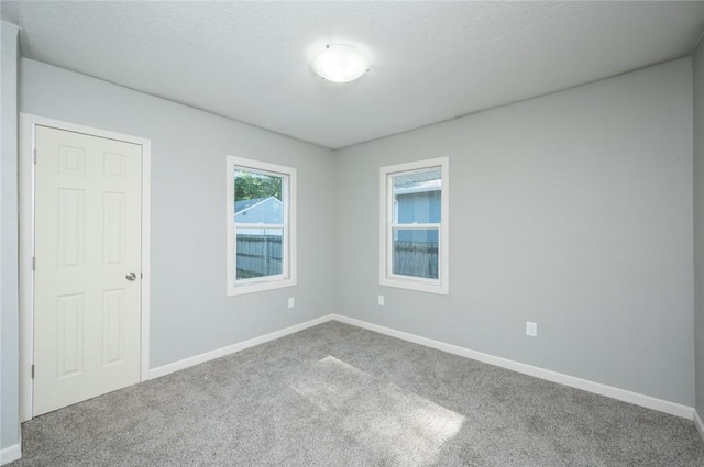 1613 York St, Des Moines, IA 50316 - carpeted spare room with baseboards