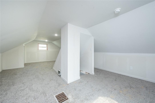 1613 York St, Des Moines, IA 50316 - additional living space featuring carpet floors and vaulted ceiling