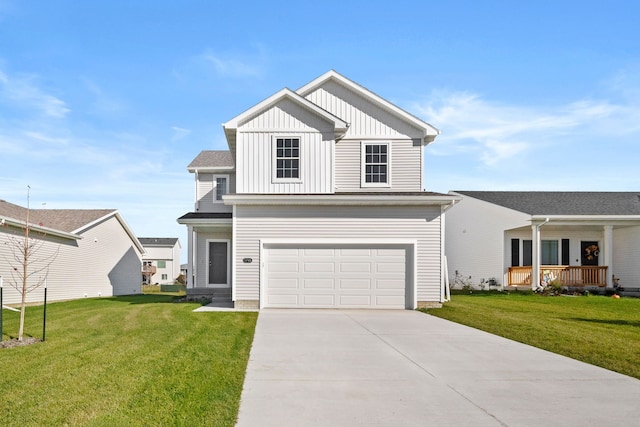 view of front of house featuring covered porch, a garage, and a front yard