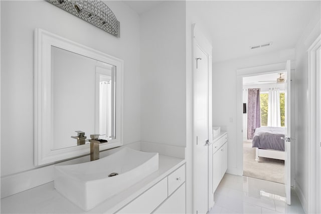 bathroom featuring tile flooring, vanity, and ceiling fan