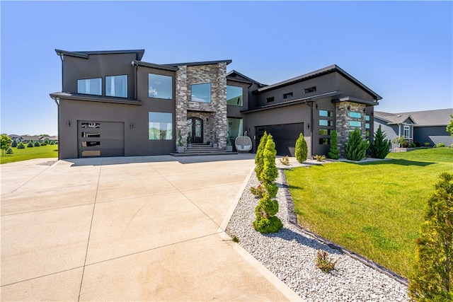 modern home featuring a garage and a front yard