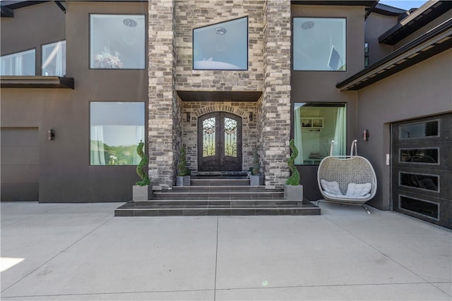 property entrance featuring french doors