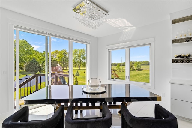 dining space with a notable chandelier and a wealth of natural light