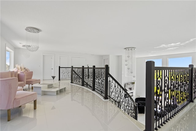 interior space featuring a notable chandelier and light tile flooring