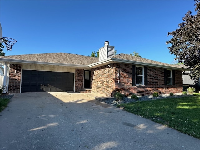 single story home featuring a garage and a front lawn