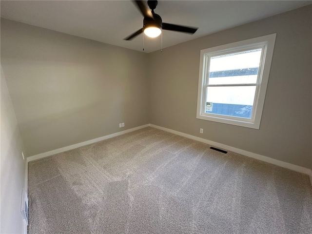 carpeted empty room with ceiling fan