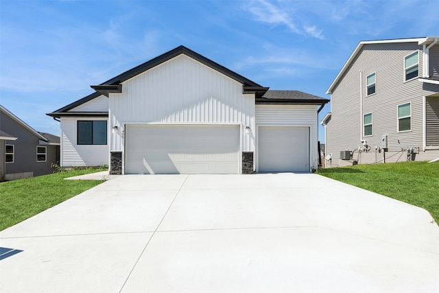 view of front facade with a garage and a front lawn