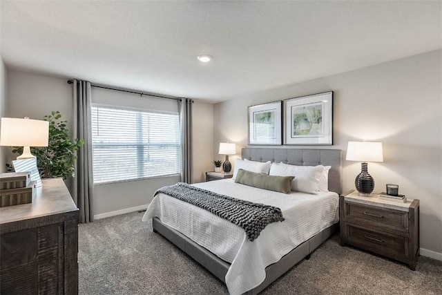 bedroom featuring baseboards and carpet flooring