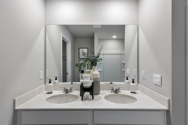 bathroom featuring double vanity and a sink