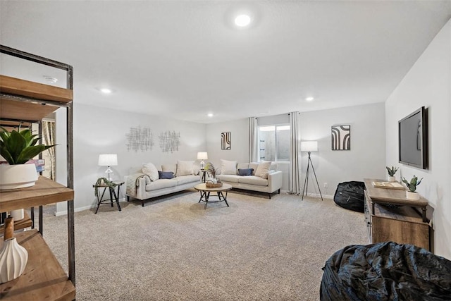 living room with recessed lighting, light colored carpet, and baseboards