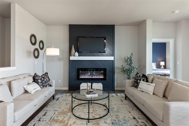 living room featuring hardwood / wood-style floors and a fireplace