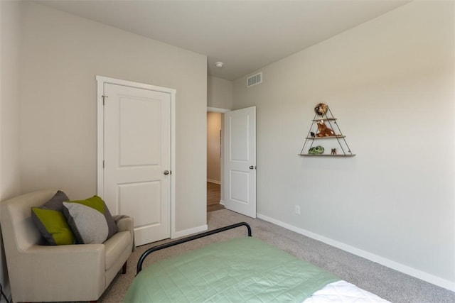 bedroom with light carpet