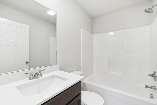 full bathroom featuring vanity, shower / washtub combination, and toilet