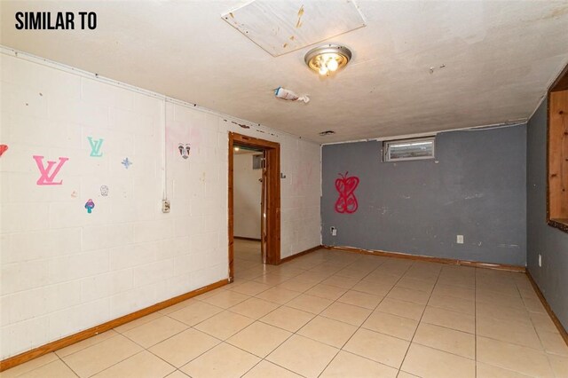 empty room featuring light tile flooring