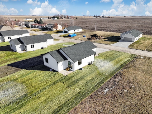 birds eye view of property with a rural view