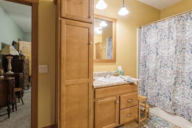 full bathroom featuring shower / tub combo with curtain and vanity