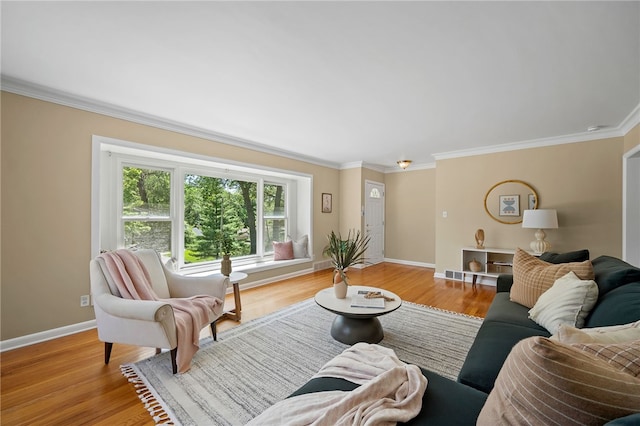 living room featuring crown molding and light hardwood / wood-style floors