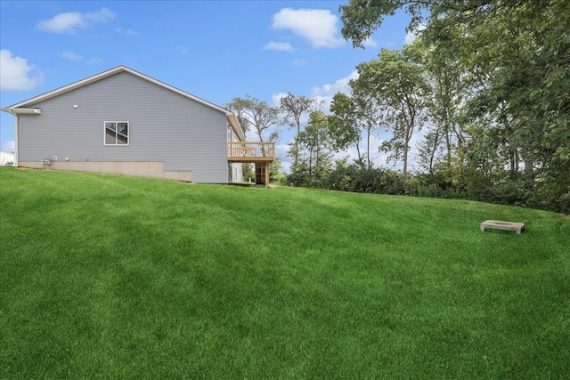 view of yard with a wooden deck