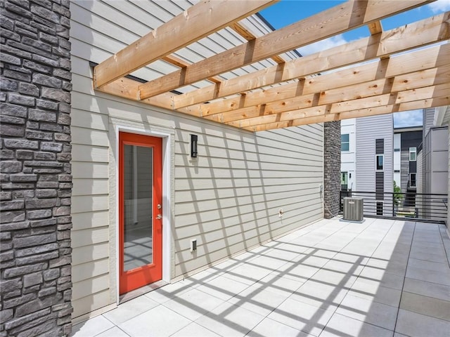 view of patio / terrace featuring central AC and a pergola