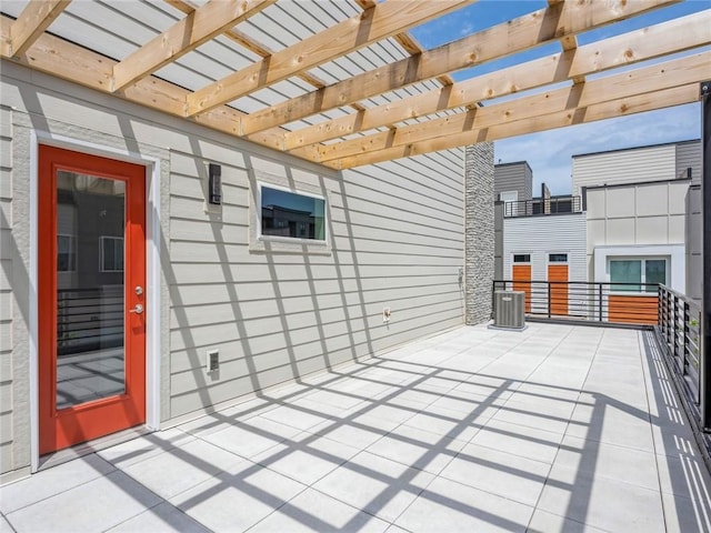 view of patio featuring central AC unit and a pergola