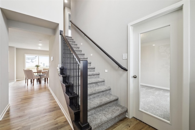 stairway with wood-type flooring