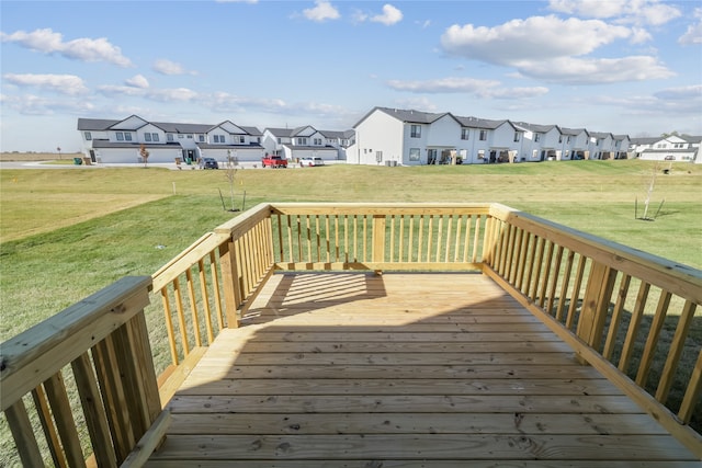 wooden terrace with a yard