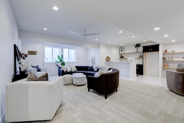 living room with ceiling fan and light carpet