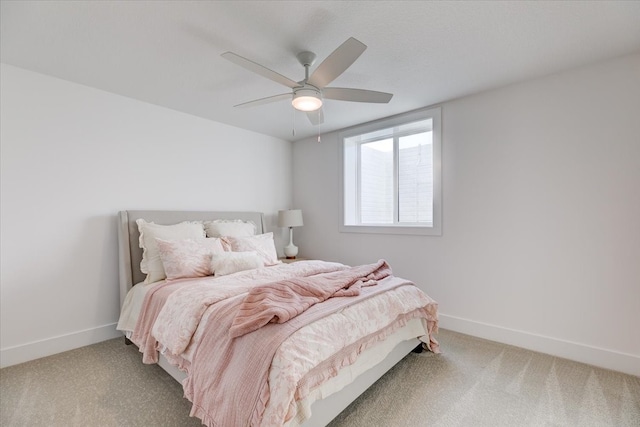 bedroom with ceiling fan and carpet flooring