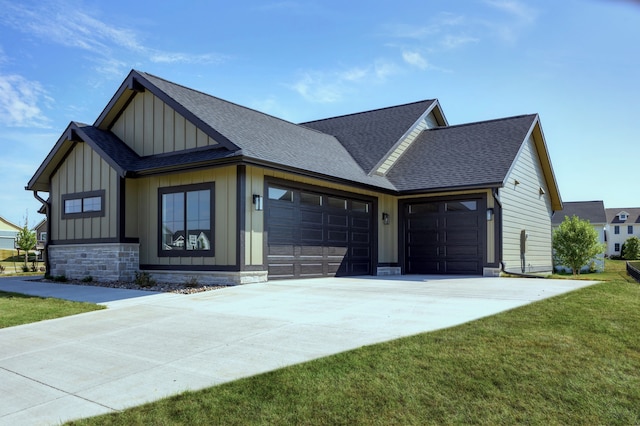 view of front facade with a garage and a front lawn