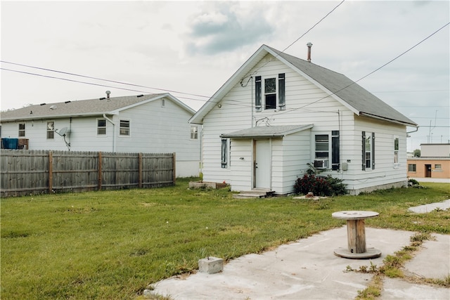 back of property featuring a yard and a patio area