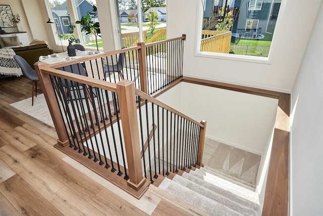 stairway featuring hardwood / wood-style floors