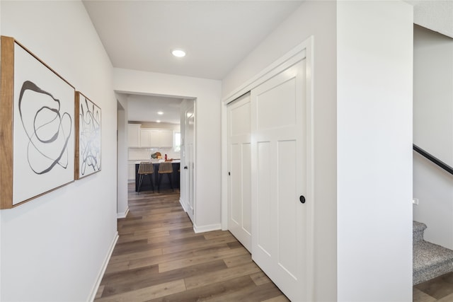 corridor with wood-type flooring