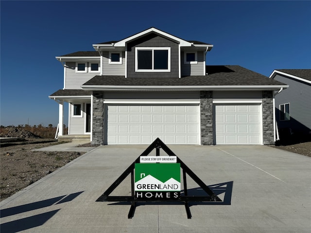 view of front of property featuring a garage