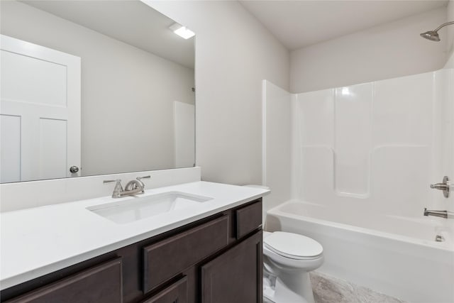 full bathroom featuring washtub / shower combination, toilet, and vanity