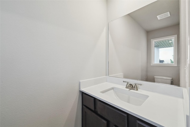 1355 Locust St, Waukee, IA 50263 - half bathroom with toilet and vanity