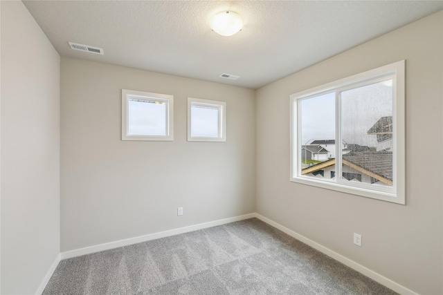 1355 Locust St, Waukee, IA 50263 - carpeted empty room featuring baseboards
