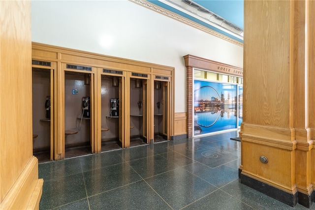 hallway featuring a towering ceiling